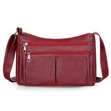Simaságú crossbody táska több zsebbel